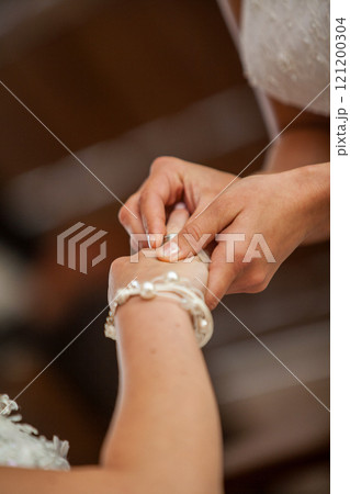 An Elegant Wedding Ceremony Featuring a Beautiful Hand Holding Moment Between the Couple An Elegant Wedding Ceremony Featuring a Beautiful Hand Holding Moment Between the Couple 121200304