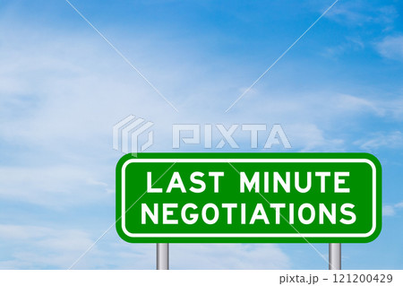 Green color transportation sign with word last minute negotiations on blue sky with white cloud background 121200429