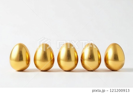 Easter golden decorated eggs stand in a row on white background. Minimal easter concept. Happy Easter card with copy space for text . 121200913