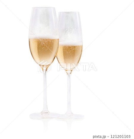 Celebratory champagne flutes filled with bubbly drink on a white background 121201103