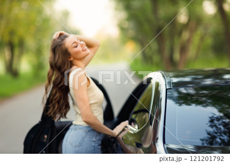 Happy woman driver at car smiling. Cute young happy brunette female driving car vehicle Happy woman driver at car smiling. Cute young happy brunette female driving car vehicle 121201792