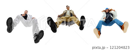 Group of confident young people wearing modern streetwear fashion, dynamically posing against white background. Bottom view 121204823