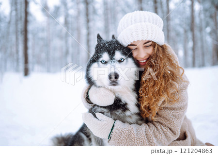A young woman with her pet on an adventure. Friendship concept, pets. 121204863