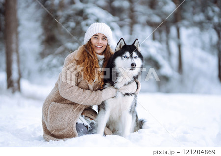 A young woman with her pet on an adventure. Friendship concept, pets. 121204869