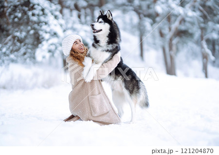 A young woman with her pet on an adventure. Friendship concept, pets. 121204870