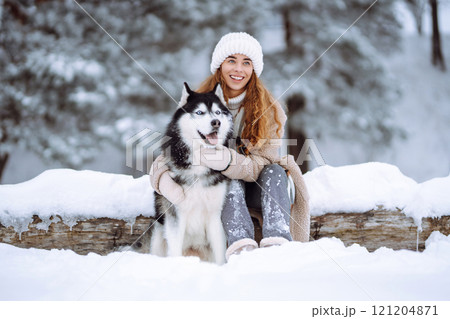A young woman with her pet on an adventure. Friendship concept, pets. 121204871