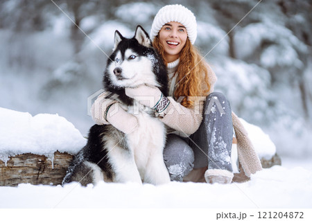 A young woman with her pet on an adventure. Friendship concept, pets. 121204872