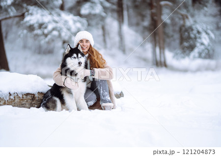 A young woman with her pet on an adventure. Friendship concept, pets. 121204873