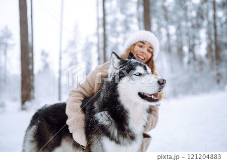 A young woman with her pet on an adventure. Friendship concept, pets. 121204883