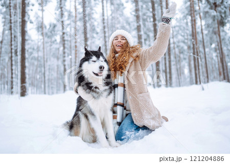A young woman with her pet on an adventure. Friendship concept, pets. 121204886