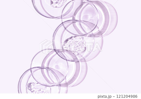 A sample of skin serum or moisturizing gel in a Petri dish. A cosmetic product. 121204986