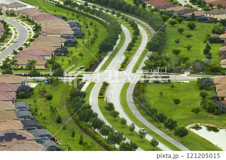 View from above of densely built residential houses in closed living clubs in south Florida. American dream homes as example of real estate development in US suburbs 121205015