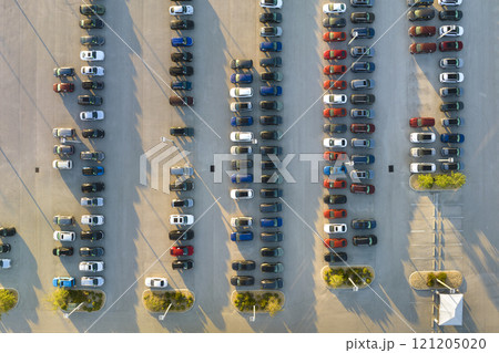 View from above of dealers outdoor parking lot with many brand new cars in stock for sale. Concept of development of american automotive industry 121205020