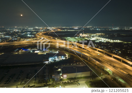 View from above of american big freeway intersection in Tampa, Florida at night with fast moving cars and trucks. USA transportation infrastructure concept 121205025