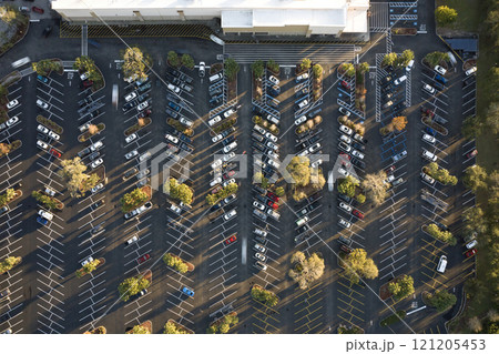 Top view of many cars parked on a parking lot in front of a shopping mall in Florida. Concept of urban transportation 121205453