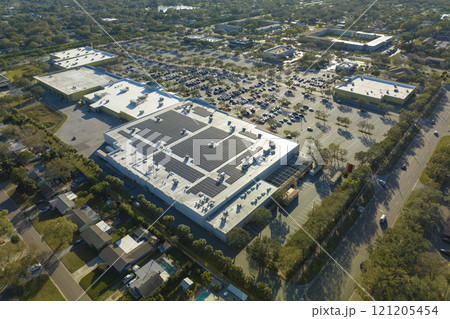 Top view of many cars parked on a parking lot in front of a shopping mall in Florida. Concept of urban transportation 121205454