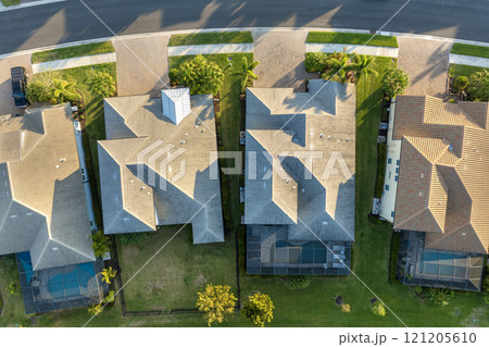 Rich neighborhood with expensive residential homes in southwest Florida. Wealthy suburban area Rich neighborhood with expensive residential homes in southwest Florida. Wealthy suburban area 121205610