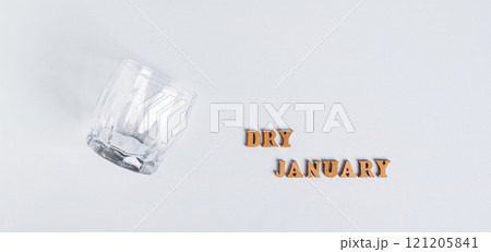 Sober January concept, empty glass and text on grey background top view web banner Sober January concept, empty glass and text on grey background top view web banner 121205841