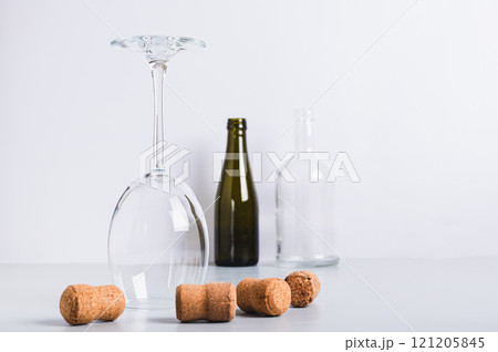 Alcohol abstinence, upside down wine glass among corks on table Alcohol abstinence, upside down wine glass among corks on table 121205845
