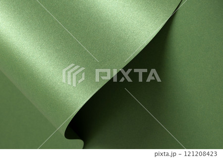Luxurious green paper background with a smooth satin texture and subtle metallic sheen. Monochrome Luxurious green paper background with a smooth satin texture and subtle metallic sheen. Monochrome 121208423