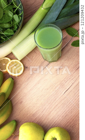 Fruits and vegetables for smoothies on a wooden background. Background with space for text  121209432