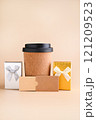 Eco-Friendly Coffee Cup with Gift Boxes Minimalist Holiday Gift Concept. tylish image featuring an 121209523