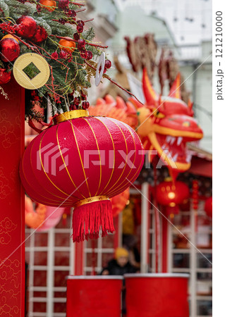 Colorful lanterns and dragon decorations adorn festive street during Chinese New Year celebration Colorful lanterns and dragon decorations adorn festive street during Chinese New Year celebration 121210000