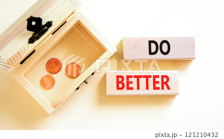 Do better symbol. Concept words Do better on beautiful wooden blocks. Beautiful white background. Wooden chest with coins. Business and do better concept. Copy space. 121210432