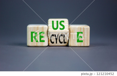 Reuse or recycle symbol. Concept words Reuse Recycle on wooden block. Beautiful grey table grey background. Business reuse or recycle concept. Copy space. Reuse or recycle symbol. Concept words Reuse Recycle on wooden block. Beautiful grey table grey background. Business reuse or recycle concept. Copy space. 121210452
