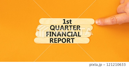 1st quarter financial report symbol. Concept words 1st quarter financial report on beautiful wooden sticks. Beautiful orange background. Business 1st quarter financial report concept. Copy space. 121210633