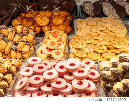 Assorted Bakery Cookies and Pastries Displayed in Trays 121211609