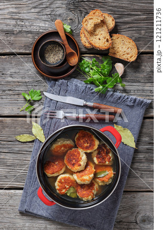 turkey potato cakes in a red pot, top view 121211736