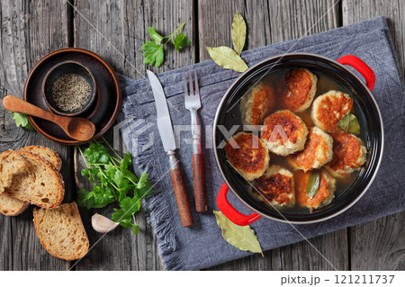 turkey potato cakes in a red pot, top view 121211737
