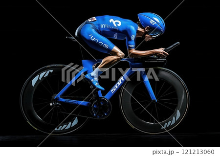 Professional cyclist riding a time trial bike in a velodrome 121213060