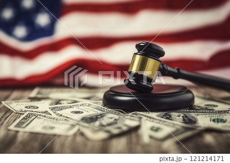 Judge gavel resting on american dollars with united states flag background 121214171