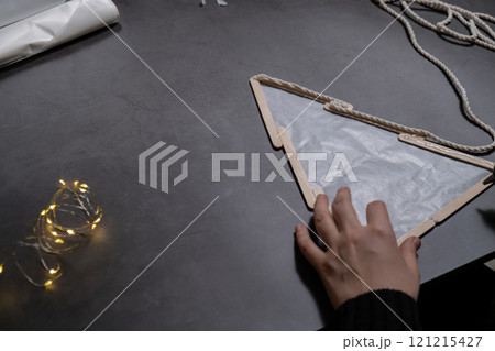 Ice cream sticks Christmas tree Sustainable preparation Diy process making handmade decoration. Step by step activity for children. Inclusive and responsible stress relief holiday hobby 121215427