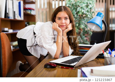 Portrait of a charming girl in company office 121215867