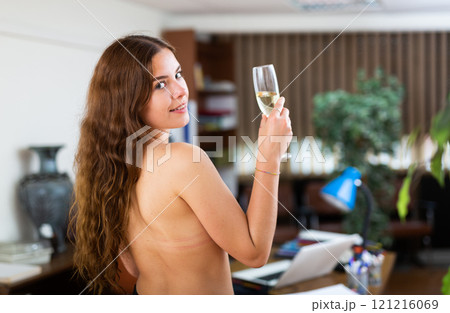 Portrait of bare body girl posing near the table in office 121216069