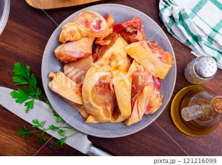 Bowl with raw sliced chicken, food preparation 121216099