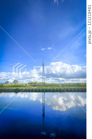 Serene Reflections of a Tower Rising Majestically Above Calm Water Surfaces Nearby Serene Reflections of a Tower Rising Majestically Above Calm Water Surfaces Nearby 121218481