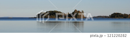 Small islands covered by forest in Lake Vanern on a autumn day, Sweden. Small islands covered by forest in Lake Vanern on a autumn day, Sweden. 121220282