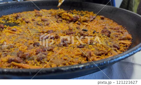 Delicious Iberian Secreto Paella Being Served Freshly Cooked Delicious Iberian Secreto Paella Being Served Freshly Cooked 121221627