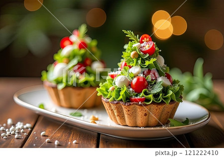 Vegetable salad appetizer in form of Christmas trees of tomato, lettuce and cucumber on festive New Year's table. Recipe and beautiful presentation. Christmas decor and table setting. AI generated 121222410