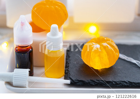 Handmade soap in the form of a tangerine with bottles of dye, flavor, a block of glycerin soap base, silicone mold, pipette. Soap as a gift, home-made 121222616