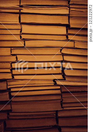 Antique bookshelf background in warm light. Pile of old books. Archive storage. Reading hobby. Library bookshelf. Literature concept. Bookstore in the night. Stacked retro books. Knowledge and wisdom. Antique bookshelf background in warm light. Pile of old books. Archive storage. Reading hobby. Library bookshelf. Literature concept. Bookstore in the night. Stacked retro books. Knowledge and wisdom. 121222972