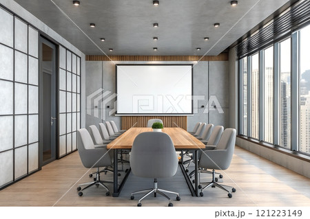 Modern conference room with large windows overlooking a city skyline 121223149