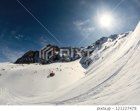 High altitude winter landscape of the mountain range with ski and snowboard path, Sunny winter day in the mountains. 121227478