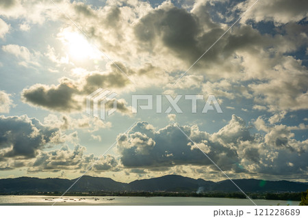 Beautiful clouds in sunset or sunrise over sea,Colorful scenery sunset sky, Amazing clouds wonderful light sky background 121228689