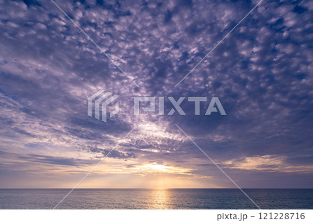 Beautiful clouds in sunset or sunrise over sea,Colorful scenery sunset sky, Amazing clouds wonderful light sky background 121228716