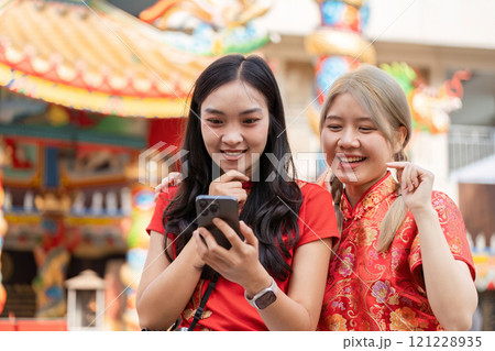 Celebrating chinese new year with tourists festive streets photo moments urban environment joyful interactions 121228935